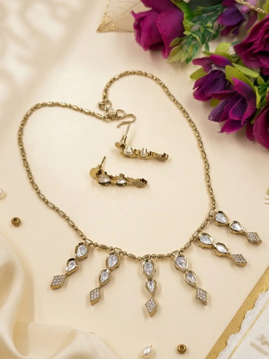 Elegant Victorian Finish Minimal Chain Necklace With Polki Drops | Indo Western Jewellery set lying on a beige surface