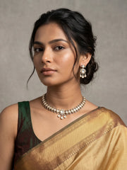 Victorian-style dual tone Polki necklace set featuring oval motifs, clear CZ and imitation stones, plus matching dangler earrings.