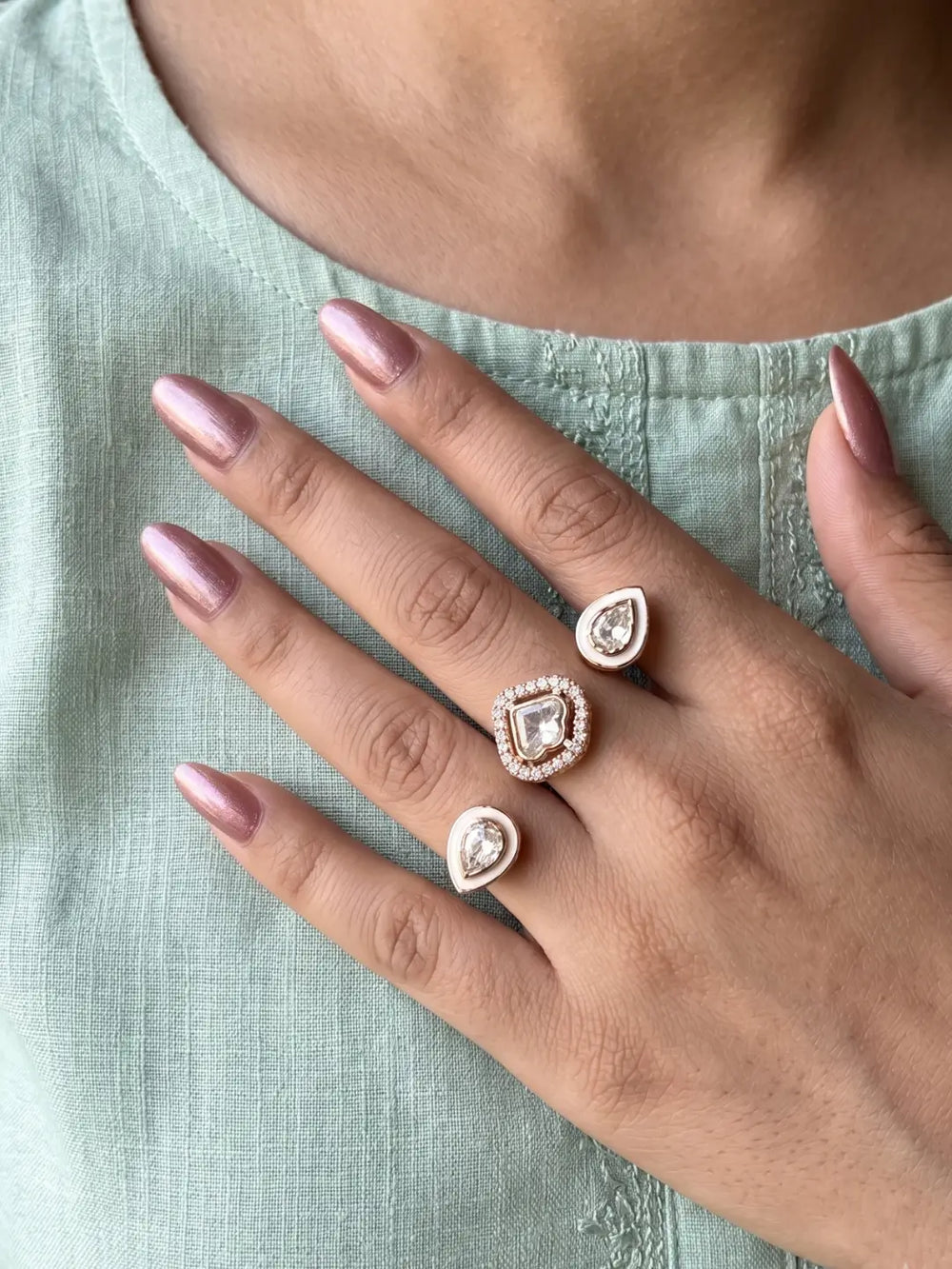 White CZ Polki dual finger ring with gold-tone bands, connected focal elements and enamel detailing, designed for bridal and festive jewellery styling
