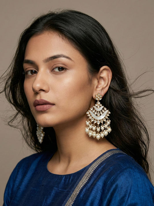 White gold plated Kundan Chandbali earrings with mother of pearl detailing and cascading pearl drops for bridal, wedding and festive looks.