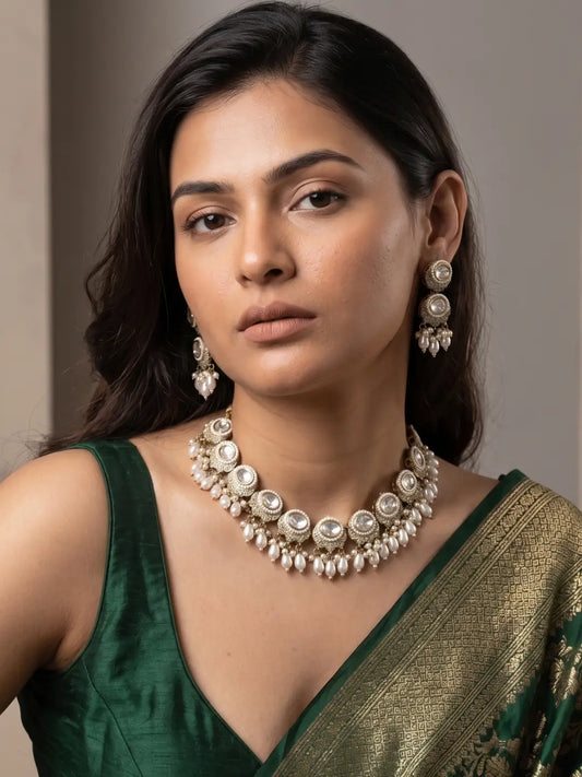 White Victorian-finish Kundan necklace with clear stones, beaded drops, pearl accents and coordinated matching earrings.