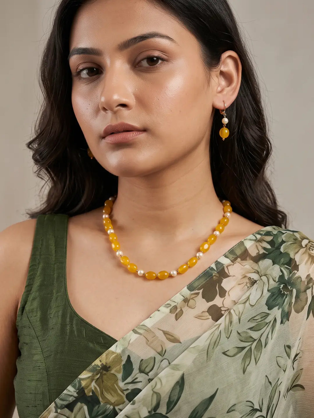 Single-strand yellow box-shaped jade bead necklace with faux pearls, shown with matching drop earrings and gold-tone accents