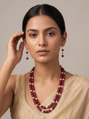 A close up portrait of a female wearing a Natural Watermelon Shaped Ruby Red Jade Beaded Necklace With Drop Earrings | Ethnic Jewellery for saree