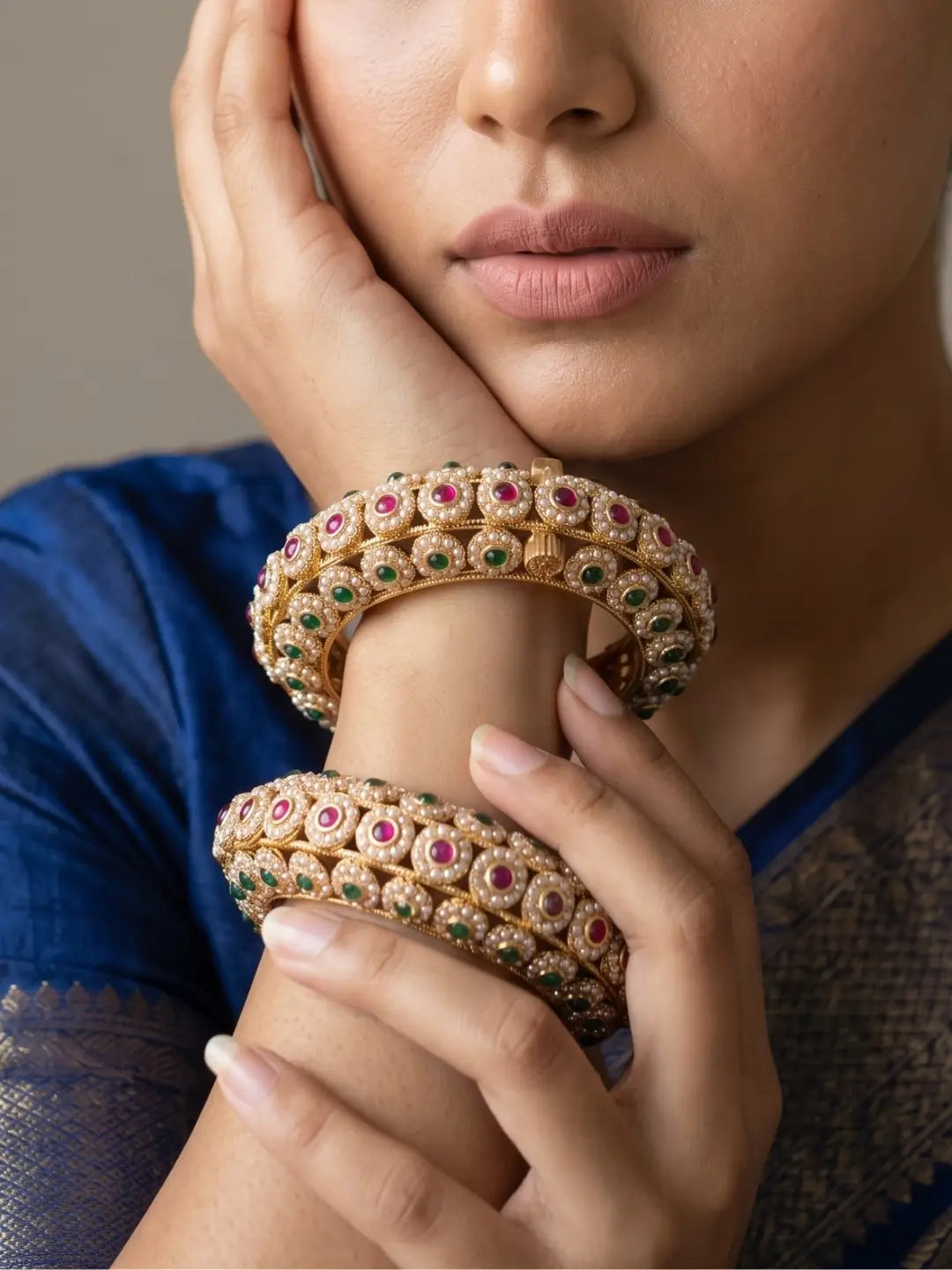 A close up of a women wearing Traditional Gold Plated Muti Colour Pearl Kada Bangles| Wedding, Bridal & Festive 
