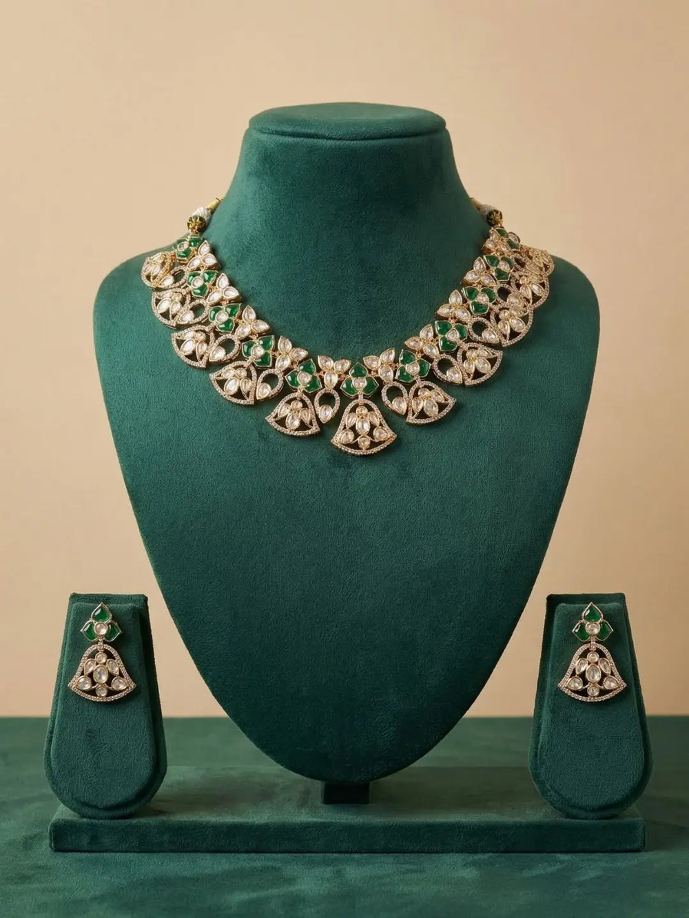 handcrafted gold-plated floral Kundan necklace set with matching earrings featuring Polki, CZ stones and  green accents, ideal for bridal wear, weddings, festive occasions, and traditional Indian jewellery.