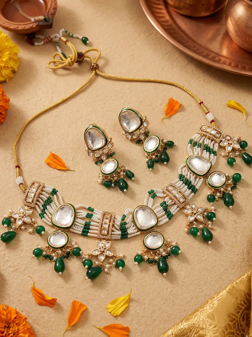 Handcrafted multi-strand Kundan Pearl choker necklace set with matching earrings featuring emerald green bead accents, perfect for bridal wear, weddings, festive occasions, and traditional Indian jewellery.
