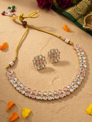Pink Kundan Necklace and earrings set on a beige background with decorative elements