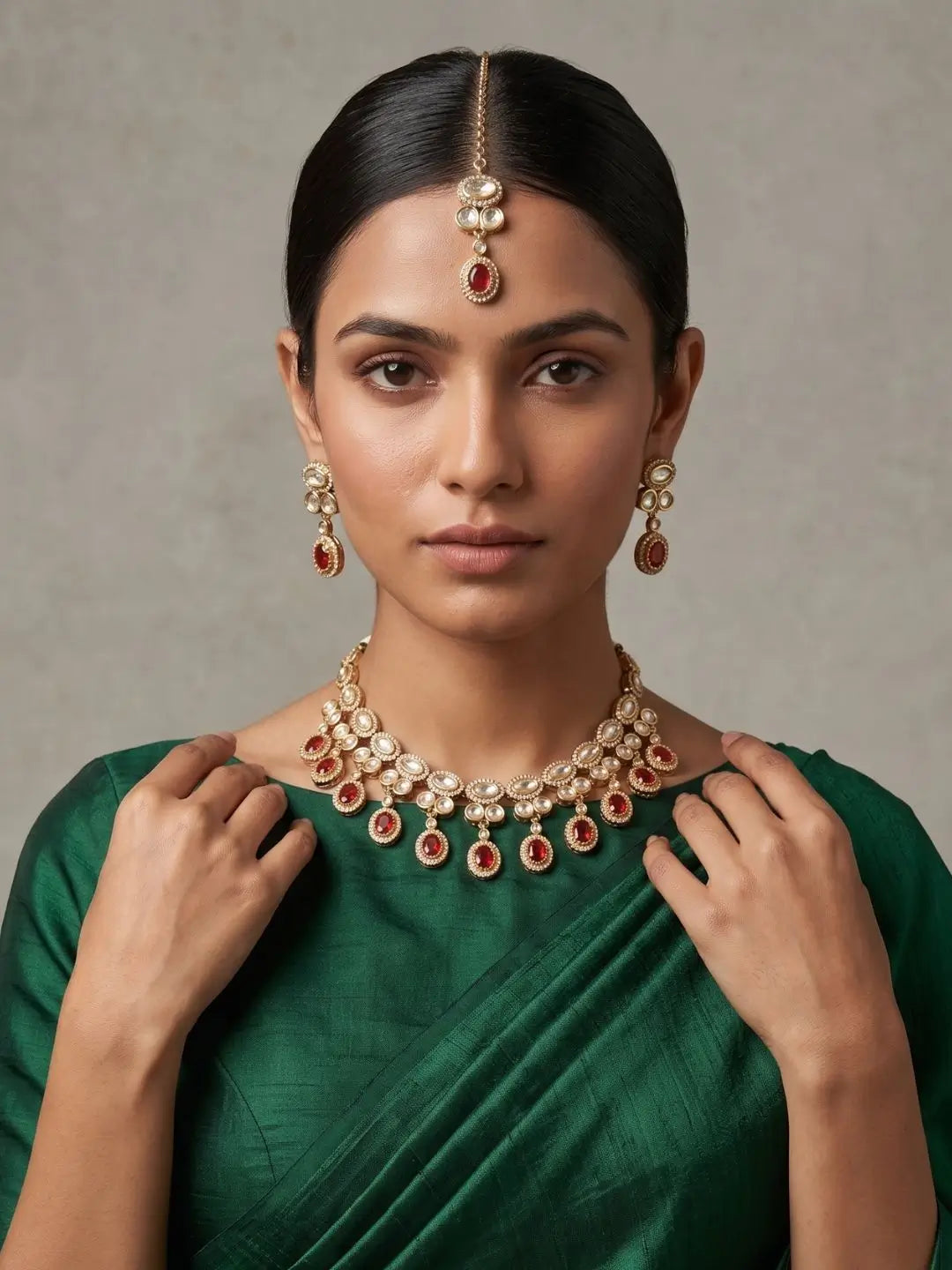 A women wearing a Gold Plated Polki Kundan Necklace Set With Tikka | Wedding & Festive Jewellery Set on a green saree