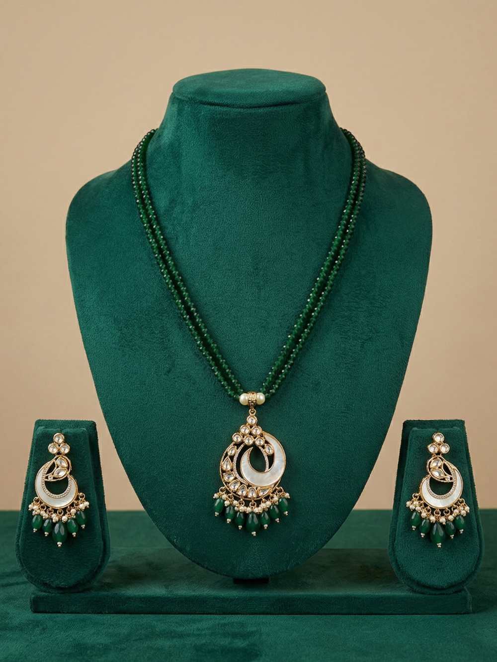 gold plated mother of pearl and kundan pendant neklace set wih green beads