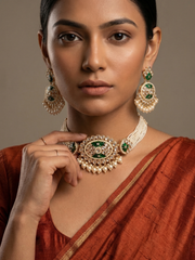 a close up view of a women wearing an Elegant multi-strand green kundan and pearl choker necklace featuring a handcrafted Kundan centrepiece with pearl drop detailing and matching earrings, ideal for bridal wear, weddings, festive celebrations, and traditional Indian jewellery.