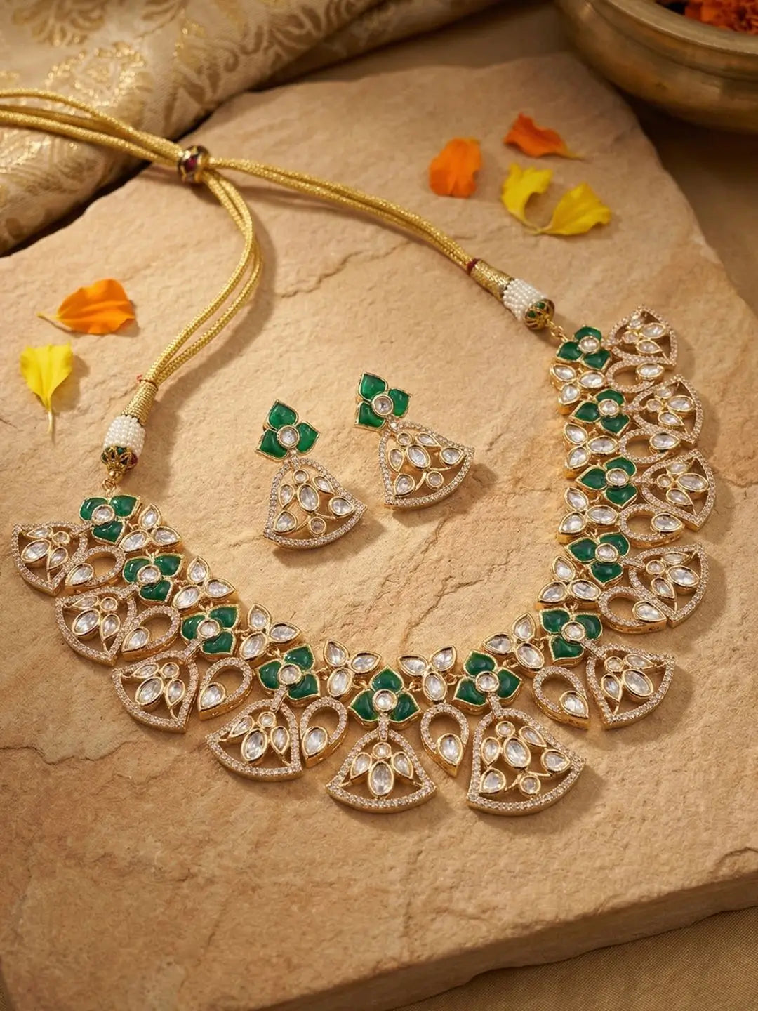 handcrafted gold-a plated floral Kundan necklace set with featuring's featuring Polki, CZ stones and  green accents, ideal for bridal wear, weddings, festive occasions, and traditional Indian jewellery.