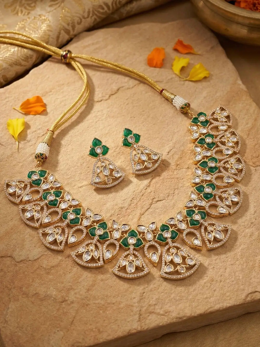 handcrafted gold-a plated floral Kundan necklace set with featuring's featuring Polki, CZ stones and  green accents, ideal for bridal wear, weddings, festive occasions, and traditional Indian jewellery.