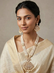 a women in whitev sarree is wearing a Moissanite Polki Long Necklace Set With Pearls - Luxury Wedding Jewellery Set
