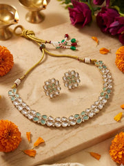 Kundan Jewelry set with necklace and earrings on a wooden surface with flowers around