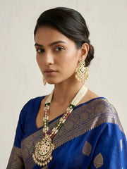 a women wearing a Traditional Long Pearls Beaded Kundan Necklace Set With red and green Enamel | Wedding Jewellery Set