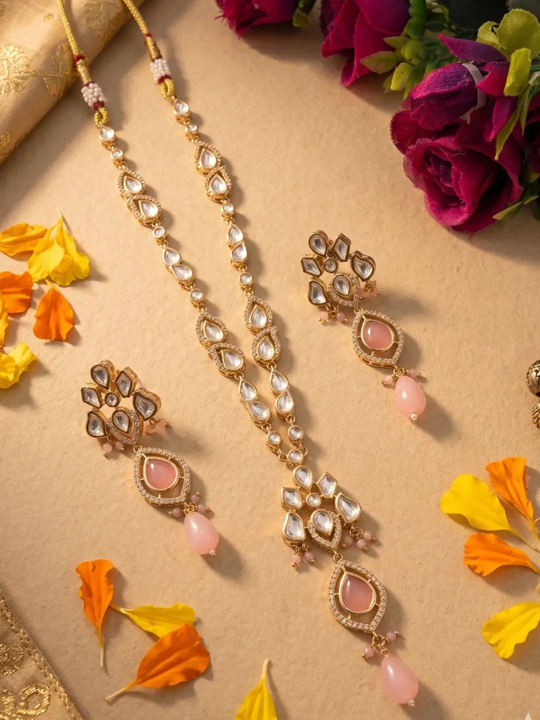 Elegant pink gold-plated Kundan pendant necklace set with polki drop pendant and matching earrings, handcrafted traditional Indian jewellery for weddings, festive occasions, party wear, and ethnic outfits.