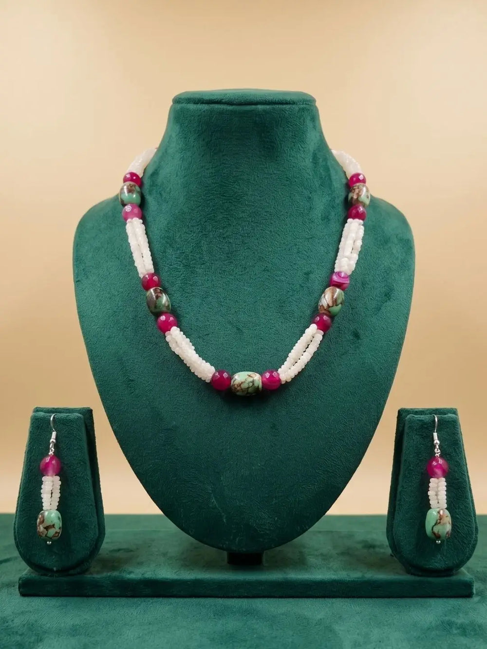 Handcrafted White Rainbow Moonstone faceted beads necklace with natural Turquoise oval beads, Pink Onyx gemstones, and matching earrings displayed on a decorative background.