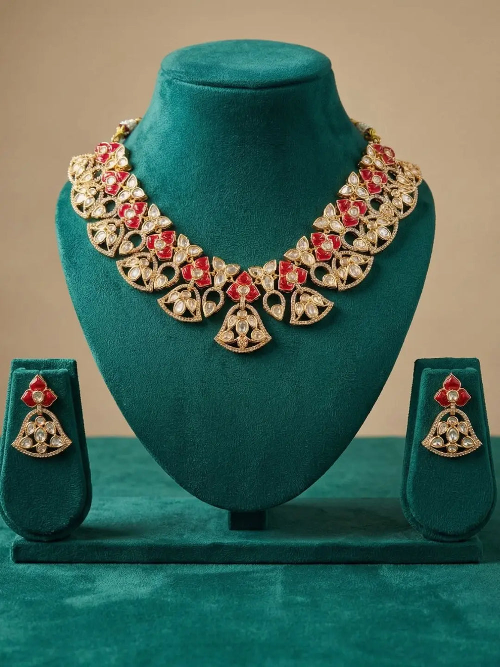 handcrafted gold-plated floral Kundan necklace set with matching earrings featuring Polki, CZ stones and  ruby red accents, ideal for bridal wear, weddings, festive occasions, and traditional Indian jewellery.