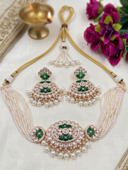 Elegant multi-strand green kundan and pearl choker necklace featuring a handcrafted Kundan centrepiece with pearl drop detailing and matching earrings, ideal for bridal wear, weddings, festive celebrations, and traditional Indian jewellery.