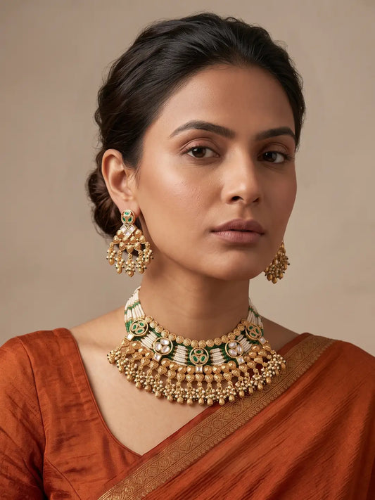 a women wearing a Traditional Antique Gold Plated Green Beaded Heritage Kundan Jewellery Set on a saree